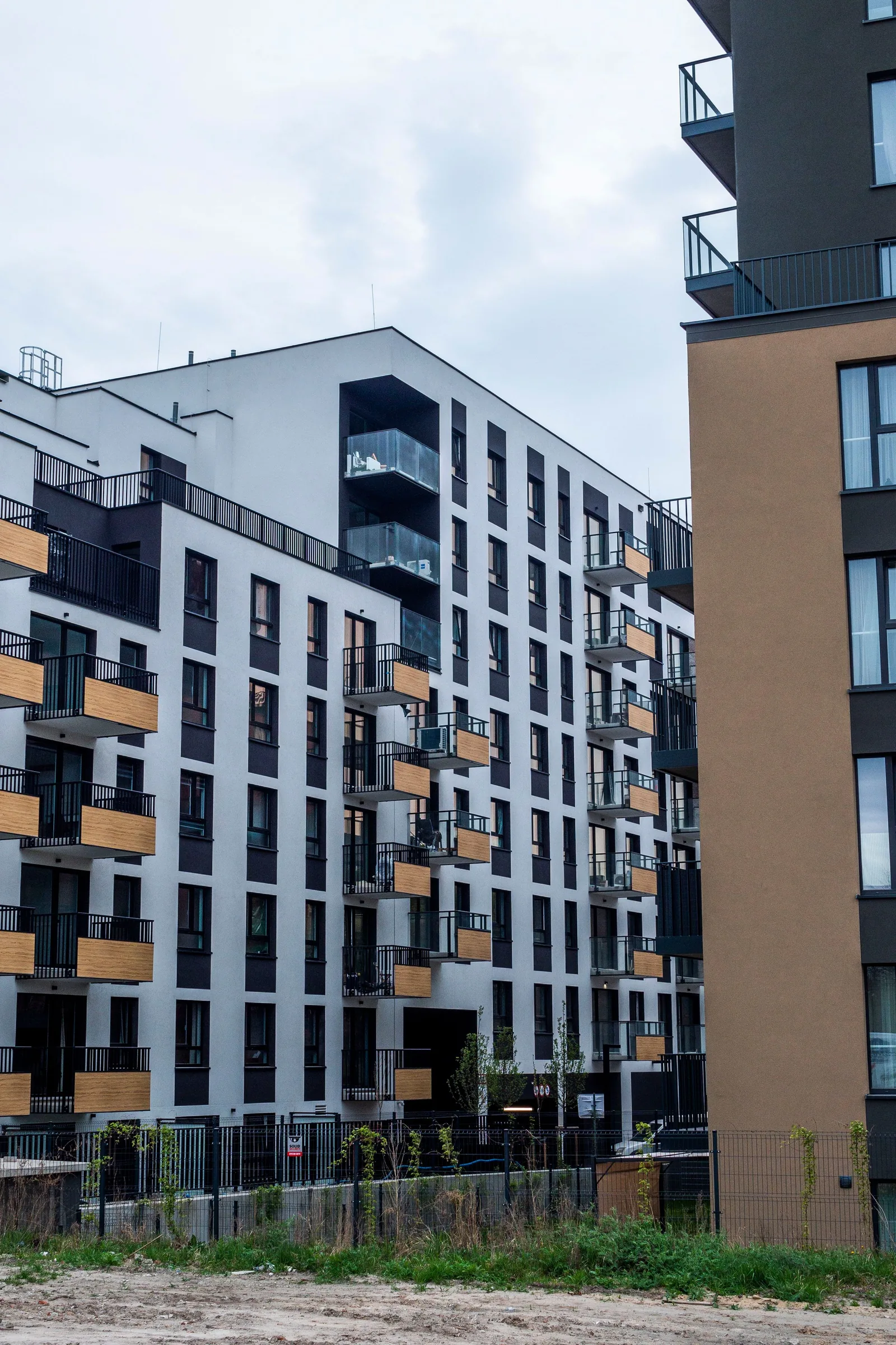 Marlow Yard, timber-lined balconies on the dark brick frame